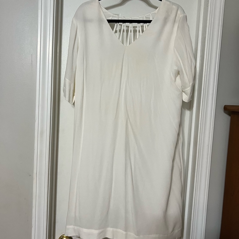 Adorable white dress with detail in the back